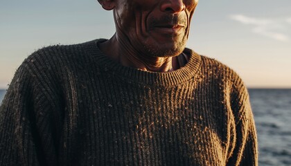 Elderly Man Wearing Dark Sweater Standing Near Water During Sunset