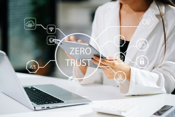 Zero trust security concept Person using computer and tablet with zero trust icon on virtual screen of Data businesses.in office