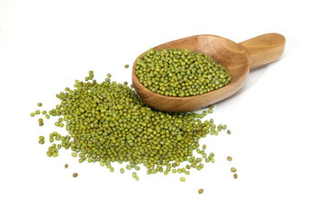 Whole green moong dal or mung beans or green gram (Vigna radiata) green legumes spilled out of wooden scoop