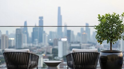 Obraz premium Rooftop terrace with modern seating overlooking a blurred city skyline.