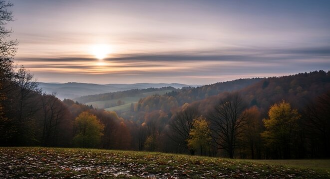 Autumnal sunrise over rolling hills and vibrant forests scenic landscape