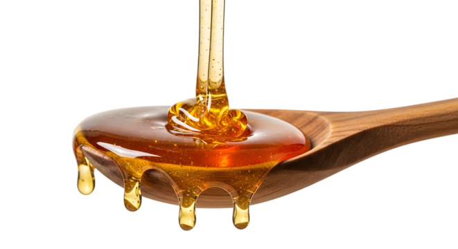 Golden viscous honey pouring onto wooden spoon, natural sweet