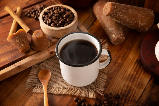 Cafe de Olla, traditional black Mexican coffee, spiced with cinnamon and piloncillo, prepared in a pot and served in a handmade clay cup called a jarrito.