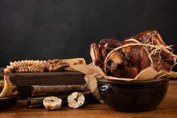 Steaming Smoked Pork Hocks in a Rustic Ceramic Pot
