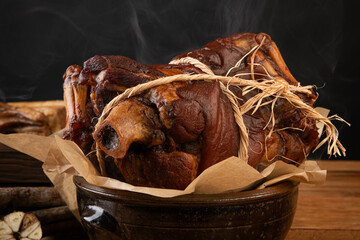 Steaming Smoked Pork Hocks in a Rustic Ceramic Pot