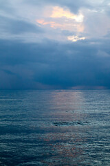 A picturesque serene ocean view stretches to the horizon under a tranquil sky, shimmering water, calm waves, nature, landscape in Kerala, India.