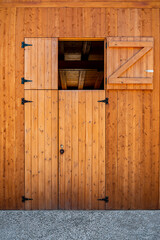 Dutch barn door with open top half and Z-braced wooden panel