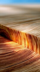 Close-up view of the textured edges of a stack of paper, illuminated by warm light, with a soft blue sky in the background.