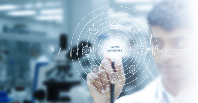 A medical professional uses a digital cancer awareness interface focused on prevention, early detection, health education, and advanced healthcare technology in a modern medical environment.