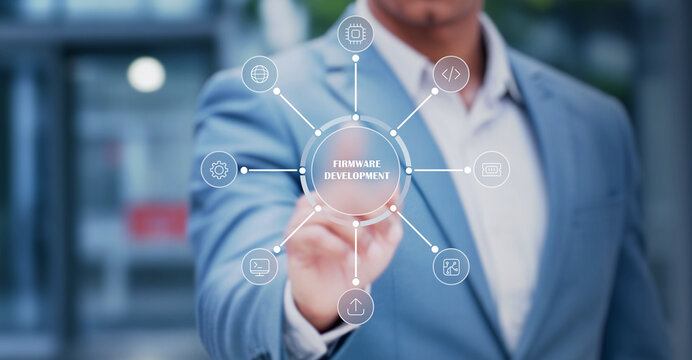 Business Professional Using Futuristic Firmware Development Interface Showcasing Embedded Systems, Software Engineering, Coding, and Modern Technology Innovation