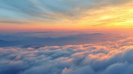 A stunning sunset paints the sky with vibrant hues as clouds softly blanket the rugged mountain landscape. This picturesque scene captures the tranquility of nature at dusk.