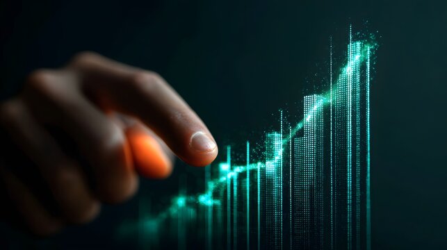 Hand touching a glowing digital graph showing business growth and financial success.