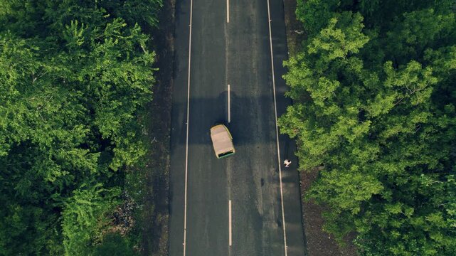 Aerial View of Auto Rickshaw Traveling Toward Gaman Bridge (Maharana Pratap Setu) in Banswara, Rajasthan, India, offering a unique experience over the scenic Mahi River and its natural surroundings.