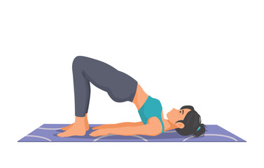 Woman practicing yoga doing bridge pose on the mat