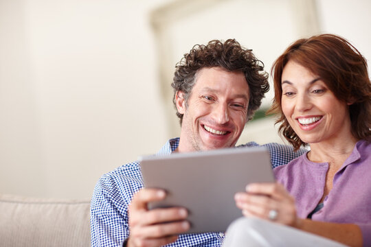 Happy, couple and relax with tablet at house for social media, browsing website and bonding. Smile, people and digital for streaming movies, download ebook and video subscription for weekend break