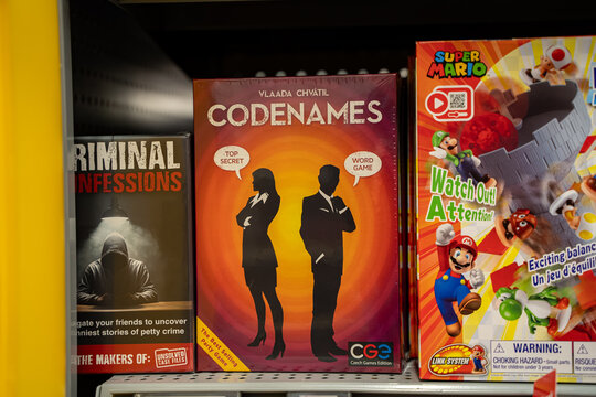 View of Codenames board game displayed on store shelf. Toronto, Canada - November 26, 2025.