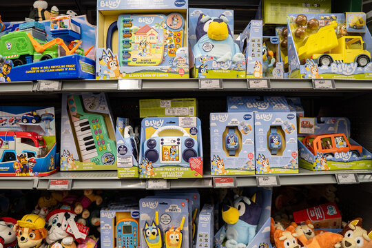 View of Bluey themed toys displayed on store shelves. Toronto, Canada - November 26, 2025.