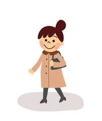 コートを着て歩いている女性