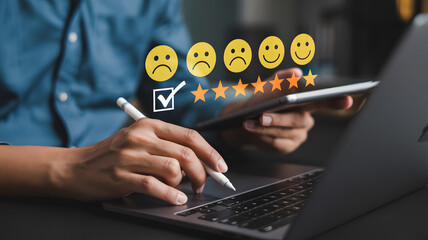 Close-up photograph of hands using laptop and tablet with customer review interface concept of feedback service evaluation and satisfaction