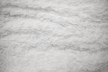  Cloth is white. This is a photograph of a crumpled fabric background