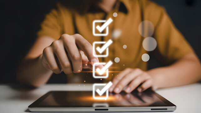 Close-up photograph of hands interacting with digital interface displaying checkmark icons concept of approval verification and technology