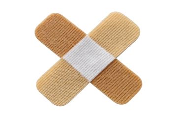 Two adhesive bandages are crossed in an X shape on a clean white background, symbolizing first aid and minor injury.