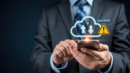 Business professional interacts with mobile device displaying cloud data transfer alert