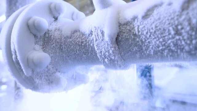 Frozen Industrial Pipe and Valve with Ice Buildup