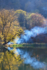 Smoke on Gosh lake in Autumn. Tavush, Armenia