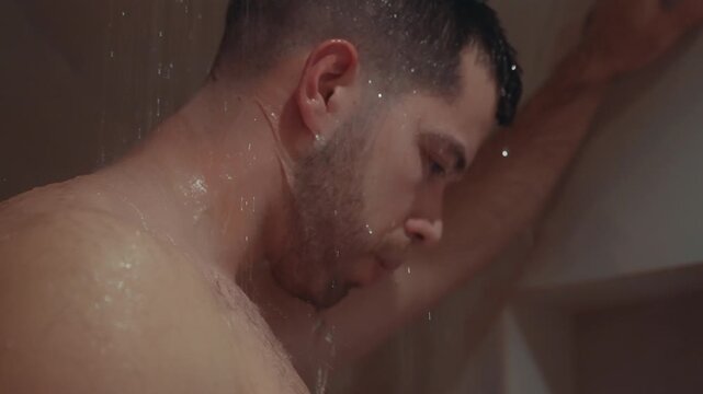 Man enjoying a refreshing shower, relaxing and washing in the morning steam