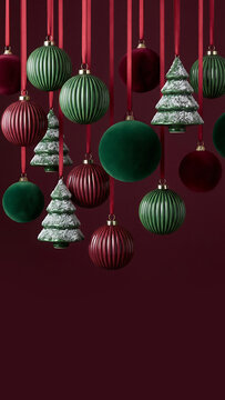 Christmas background with hanging green and red ornaments on dark red background. Space for text.	