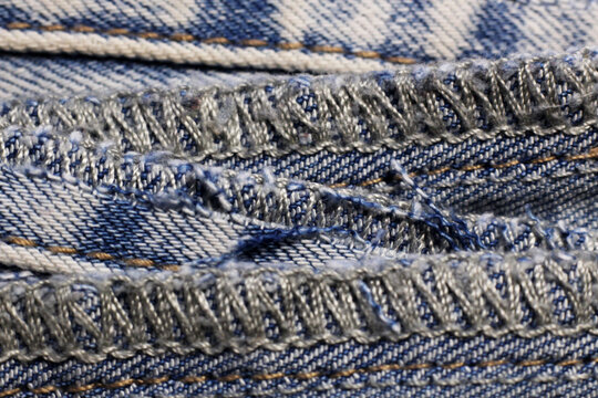 Overlocked denim edge. Sewing technique.