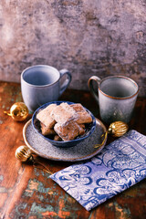 Traditional christmas cookies in a bowl on a rustic wooden background. Soft focus.	