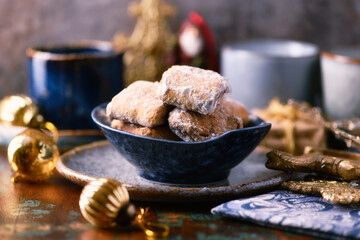 Traditional christmas cookies in a bowl on a rustic wooden background. Soft focus.	