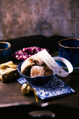 Traditional christmas cookies in a bowl on a rustic wooden background. Soft focus.	