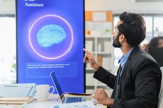 Business professional concentrates in coworking space leveraging AI powered virtual assistant and realtime big data analytics on laptop display for hyper automated workflow intelligence optimization	