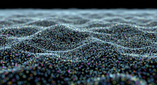 Abstract digital field of glowing multicolored particles forming a wavy, undulating surface with a shallow depth of field, creating a futuristic technological landscape on a dark background