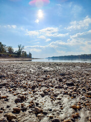 Pebble Shoreline Under Morning Sun