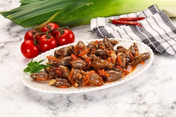 Baked chicken hearts with vegetables