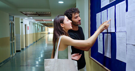 Indian young adult gen z busy pupil girl boy look board do check study report exam results date...