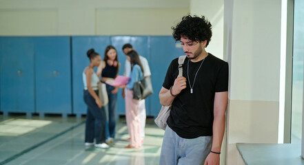 Indian sad young adult gen z man guy wear bag feel low look upset fail in study exam result indoor campus place alone lost tensed male boy suffer mental health issue social bully live bad hostel life