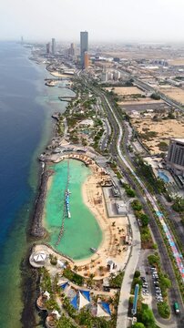 Jeddah Saudi Arabia Jun 1 2025: Aerial view of jeddah city, skyline of Waterfront, Red Sea - drone landscape panorama 4k vertical video