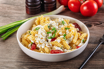 Italian pasta fusili with curd