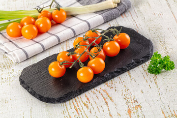 Ripe juicy yellow cherry tomatoes