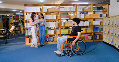 Indian young adult man sitting wheel chair take part group study speak share new ideas indoor gen z...