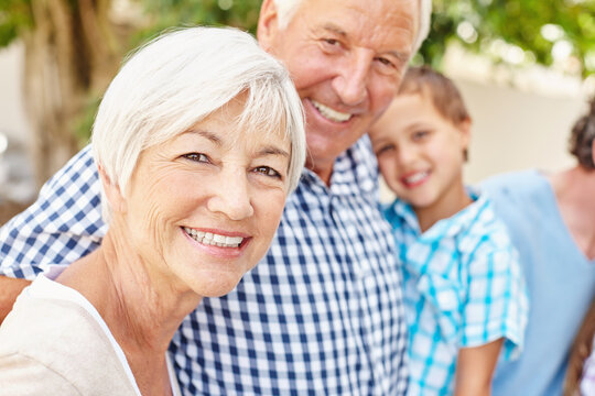 Outdoor, portrait and grandparents with boy for family time, support and connection for weekend visit. Happiness, bonding together and senior people with care for child, smile and loving relationship