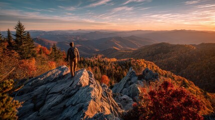 Autumn mountain hike: quiet peak moment amid fiery leaves