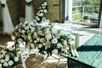 Elegant festive table setting with green decor and glassware