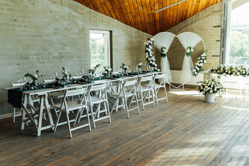 Elegant festive table setting with green decor and glassware