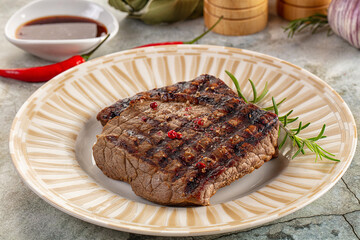 Grilled juicy beef steak with pepper